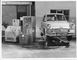 Peter Challis's Ford Anglia 105E (Pompadour Blue, white wall tyres) on Mike Wilkey's R&I vibration platform, 1962